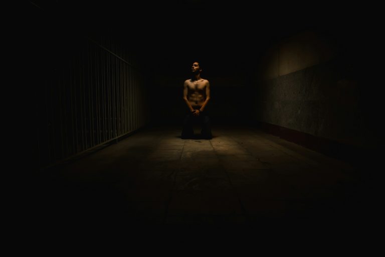 Man meditating during his dopamine detox, rebuilding his mind.