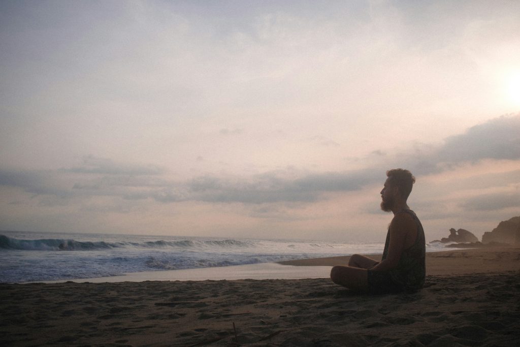 A man training his mind through meditation.