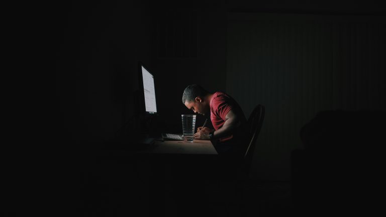 Man practicing deep work in a distraction-free environment, symbolizing single-tasking focus.