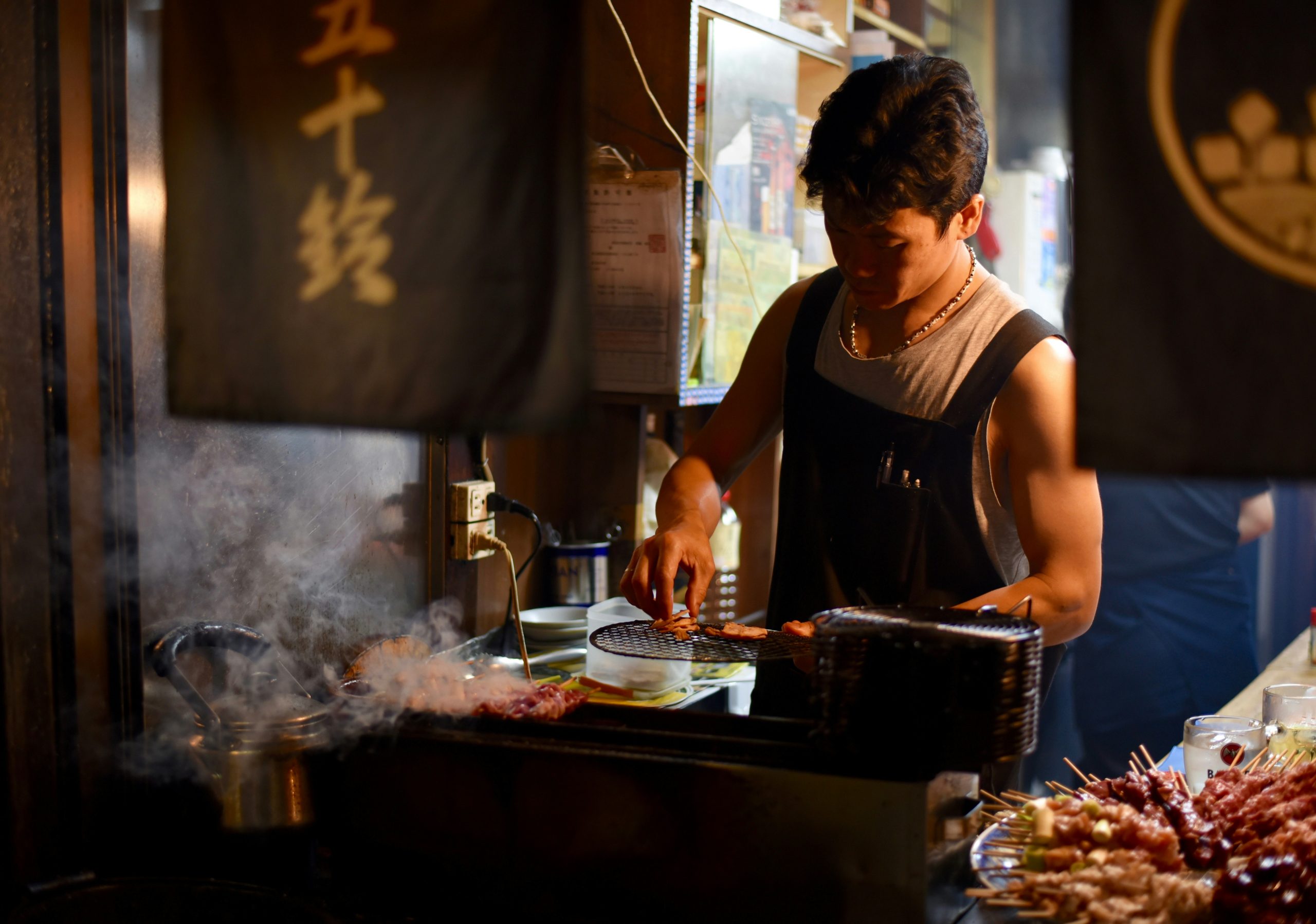 Man preparing a clean meal with steak, eggs, and vegetables—clean eating for strength and focus.