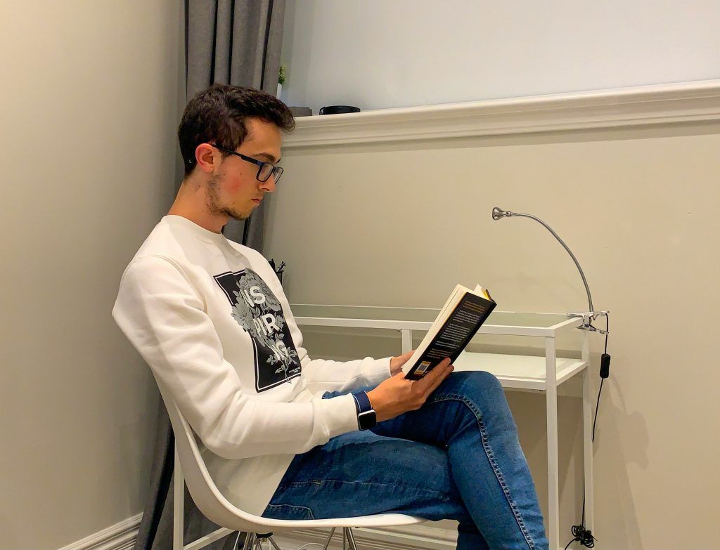 Man journaling in a focused environment without phone nearby