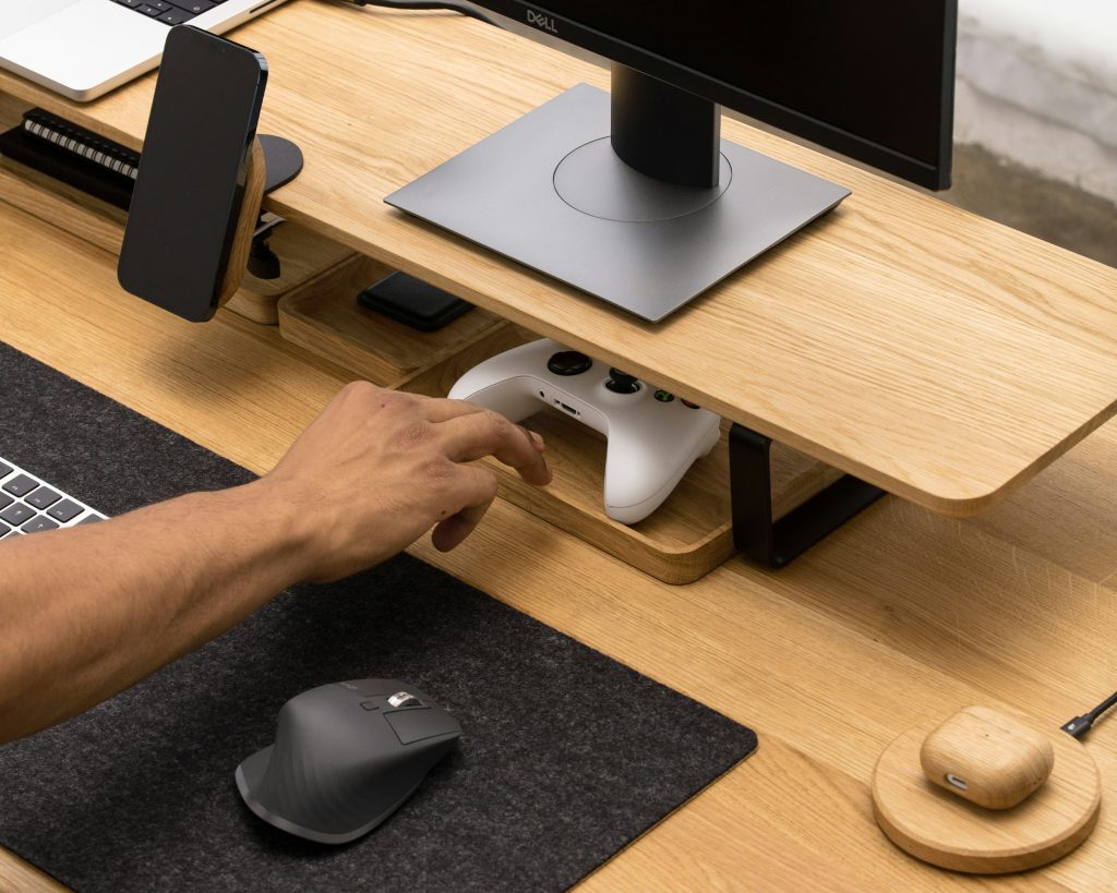 Hand resisting the urge to grab the controller, symbolizing self-control.