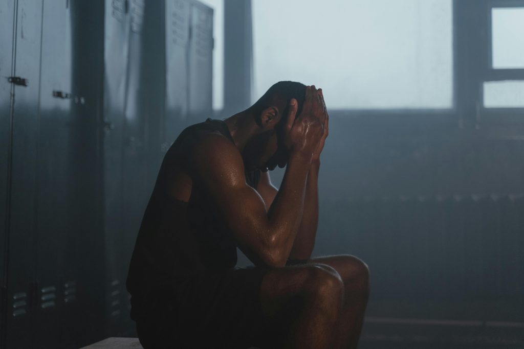 A man after a hard workout, symbolizing mental breakthrough through physical challenge